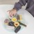 big_TV298-child-picking-up-a-biscuit-from-wooden-play-set.jpg
