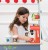 big_TV299-cafe-machine-barista-red-cups-coffee-pods-and-spoon-child.jpg